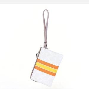2 Coach Chalk Color with Varsity Stripe Wristlet. (Lot of 2)